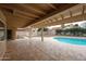 Spacious covered patio overlooking sparkling pool and beautifully landscaped backyard, ideal for entertaining at 12448 N 76Th St, Scottsdale, AZ 85260