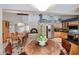 Open concept kitchen and dining area with brick fireplace offers cozy and inviting atmosphere at 12448 N 76Th St, Scottsdale, AZ 85260