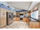 Eat in kitchen boasts stainless appliances, custom cabinets, and natural light at 12448 N 76Th St, Scottsdale, AZ 85260