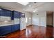 This kitchen features custom blue cabinets, white appliances, and a mosaic backsplash at 12448 N 76Th St, Scottsdale, AZ 85260
