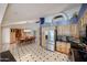 Open floor plan offers stainless steel refrigerator and custom cabinets with adjacent dining area at 12448 N 76Th St, Scottsdale, AZ 85260