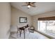 Bright living room featuring stylish tile flooring, modern ceiling fan, and a table near the window at 12448 N 76Th St, Scottsdale, AZ 85260