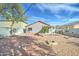 Inviting backyard with low-maintenance landscape, string lights, and a great space for outdoor activities at 12621 W Aster Dr, El Mirage, AZ 85335