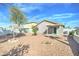 Charming backyard with a covered patio, low-maintenance landscaping, and perfect for relaxing or entertaining guests at 12621 W Aster Dr, El Mirage, AZ 85335