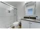 Modern bathroom with a glass-enclosed shower, vanity sink, toilet, and tile accents for a sleek look at 12621 W Aster Dr, El Mirage, AZ 85335