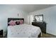Neutral bedroom featuring a decorative bed, mirror, and dresser, creating a calm and inviting space at 12621 W Aster Dr, El Mirage, AZ 85335