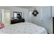 Bedroom with connecting bathroom and closet doors, with a dresser and mirror at 12621 W Aster Dr, El Mirage, AZ 85335