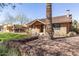 View of a brick home with a gabled roof, a front yard with desert landscaping, and a mature palm tree at 130 W Palm Ln, Phoenix, AZ 85003