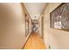 Hallway with wood flooring and natural light showcasing architectural details and design at 130 W Palm Ln, Phoenix, AZ 85003