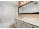 Bathroom featuring a single vanity sink, bathtub, and a large mirror at 14013 N 57Th Pl, Scottsdale, AZ 85254