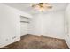 Bedroom showcasing a ceiling fan, closet, and plush carpeting at 14013 N 57Th Pl, Scottsdale, AZ 85254