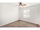 Bedroom featuring a ceiling fan, neutral carpeting, and a window at 14013 N 57Th Pl, Scottsdale, AZ 85254