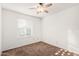 Bedroom featuring a ceiling fan, neutral carpeting, and a window at 14013 N 57Th Pl, Scottsdale, AZ 85254