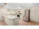Well-lit kitchen featuring white cabinetry, modern stainless steel appliances, and ample counter space for meal prep at 14013 N 57Th Pl, Scottsdale, AZ 85254
