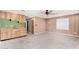 An open-concept living room area next to the kitchen features carpet and natural light from the window at 14013 N 57Th Pl, Scottsdale, AZ 85254