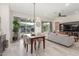 Open living and dining area with neutral decor, modern lighting, and a seamless transition to the living space at 14073 W Coronado Rd, Goodyear, AZ 85395