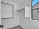Walk-in closet with built in shelving and a window at 14247 W Bronco Trl, Surprise, AZ 85387
