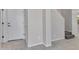 Clean entryway with neutral paint, tile flooring, and a glimpse of the staircase at 14247 W Bronco Trl, Surprise, AZ 85387