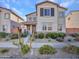 Inviting two-story home showcasing desert landscaping, a cozy porch, and neighborhood charm at 14247 W Bronco Trl, Surprise, AZ 85387