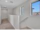 Carpeted hallway with natural light at 14247 W Bronco Trl, Surprise, AZ 85387