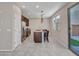 Modern eat-in kitchen featuring an island, stainless appliances, and a view of the backyard at 14247 W Bronco Trl, Surprise, AZ 85387