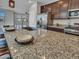 Spacious kitchen with granite countertops, stainless steel appliances, and an island with seating at 14247 W Bronco Trl, Surprise, AZ 85387