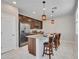 A large kitchen island with granite countertops and stainless steel appliances is the focal point at 14247 W Bronco Trl, Surprise, AZ 85387