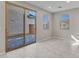 Living area with a sliding glass door and windows that fill the space with natural light at 14247 W Bronco Trl, Surprise, AZ 85387
