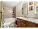 Neutral toned bathroom featuring a tub and shower combination, double sinks, and tile flooring at 14251 N 182Nd Ave, Surprise, AZ 85388