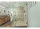 Modern bathroom with a glass-enclosed shower, double vanity, and stylish tile accents at 14251 N 182Nd Ave, Surprise, AZ 85388