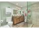 Bright bathroom featuring a glass shower, double sink vanity, and updated fixtures at 14251 N 182Nd Ave, Surprise, AZ 85388
