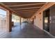 Expansive covered patio with brick columns offers ample space for outdoor entertaining and relaxation at 14251 N 182Nd Ave, Surprise, AZ 85388
