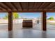 View of outdoor kitchen beneath an extensive covered patio, perfect for backyard barbecues at 14251 N 182Nd Ave, Surprise, AZ 85388