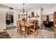 Charming dining room with wood table, chairs, and a fireplace at 14251 N 182Nd Ave, Surprise, AZ 85388