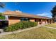 Traditional brick home with mature shrubs and manicured lawn at 14251 N 182Nd Ave, Surprise, AZ 85388