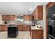 Well-lit kitchen with stainless steel appliances, tile backsplash and countertop space at 14251 N 182Nd Ave, Surprise, AZ 85388