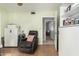 Living room with tile floor and cozy armchair at 14251 N 182Nd Ave, Surprise, AZ 85388