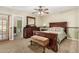 Well-lit main bedroom with a full bed and closet at 14251 N 182Nd Ave, Surprise, AZ 85388