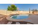 Inviting backyard pool features mature landscaping and a spacious concrete patio at 14251 N 182Nd Ave, Surprise, AZ 85388