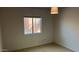 An adaptable room with neutral walls, tile flooring, and a window for natural light at 15601 N 27Th St # 5, Phoenix, AZ 85032
