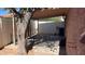 Covered patio with mature tree, fenced area, and neutral-toned stucco walls at 15601 N 27Th St # 5, Phoenix, AZ 85032