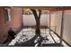 A covered patio features a mature tree and a fenced area at 15601 N 27Th St # 5, Phoenix, AZ 85032