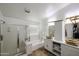 Bathroom with a shower, tub, and double vanity at 17641 W Corrine Dr, Surprise, AZ 85388