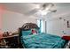 Bedroom with a ceiling fan, red lights, and a wardrobe at 17641 W Corrine Dr, Surprise, AZ 85388