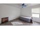 Bedroom with a ceiling fan, carpeted floors, and an air mattress at 17641 W Corrine Dr, Surprise, AZ 85388