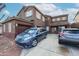 Two-story home featuring a two car garage, shutters, and easy to maintain landscaping at 17641 W Corrine Dr, Surprise, AZ 85388
