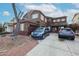 Two-story home featuring a two car garage, shutters, and easy to maintain landscaping at 17641 W Corrine Dr, Surprise, AZ 85388