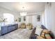 Bright living room features neutral color palette, modern furniture, and decorative lighting at 17641 W Corrine Dr, Surprise, AZ 85388