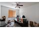 Versatile home office space with ample natural light, a ceiling fan, and neutral walls ready for personalization at 17641 W Corrine Dr, Surprise, AZ 85388
