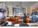A bright and well-maintained cafe area with countertop seating, serving area, and stainless appliances at 19973 N Monte Ln, Maricopa, AZ 85138